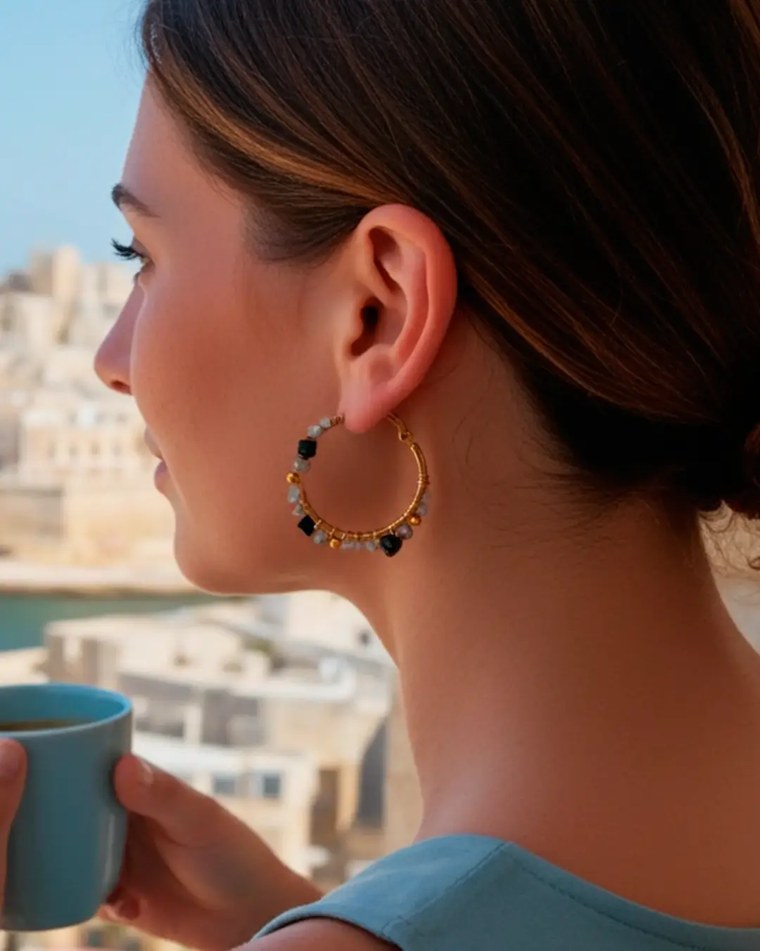 Woman wearing beige and grey Majestic Dream hoop earrings with gold accents, elegant everyday jewelry by Cutu Store.