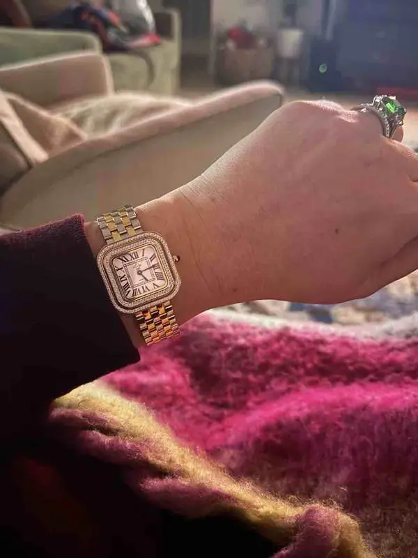 Women's GV2 Bellagio two-tone diamond watch worn on wrist indoors