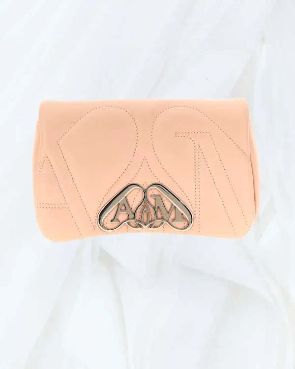 Front view of Alexander McQueen The Mini Seal beige crossbody bag