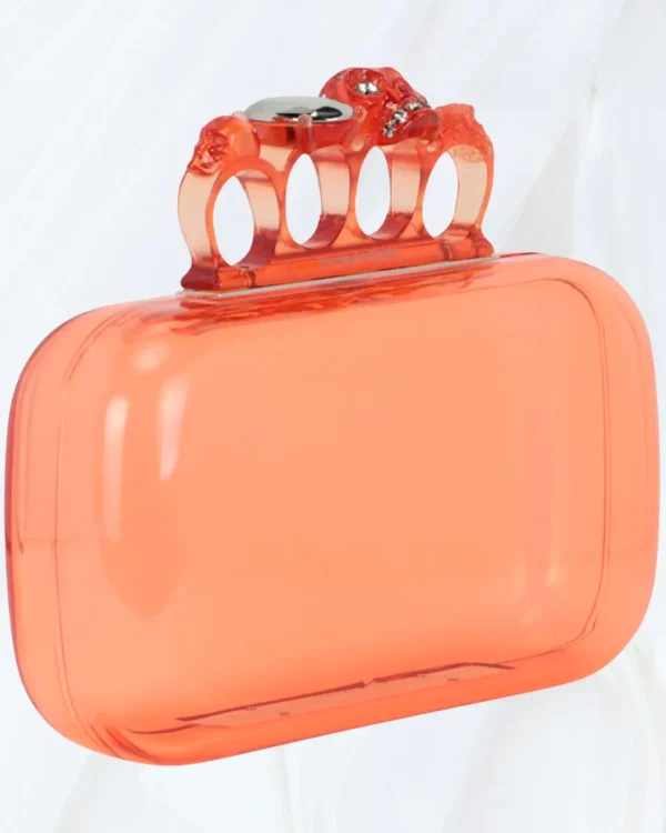Side angle of Off-White Skull Four Ring Clutch in apricot