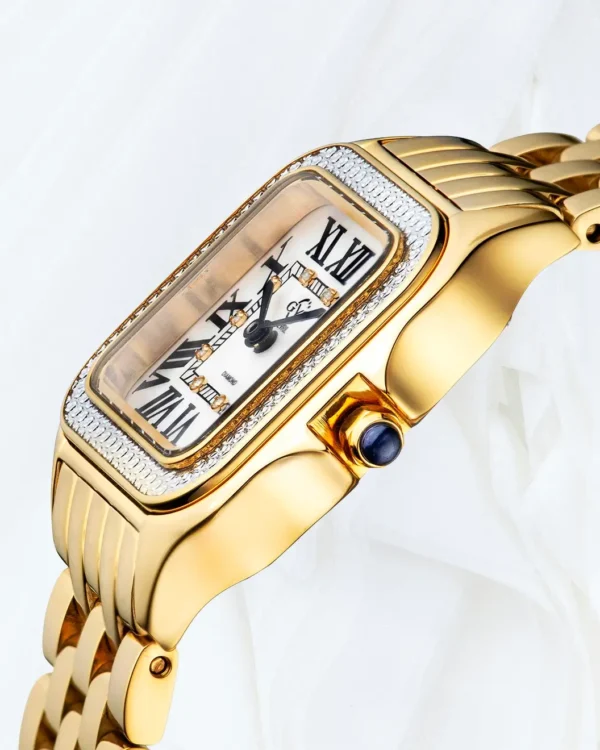 Side angle of GV2 Milan women’s gold diamond watch with blue cabochon crown Malta