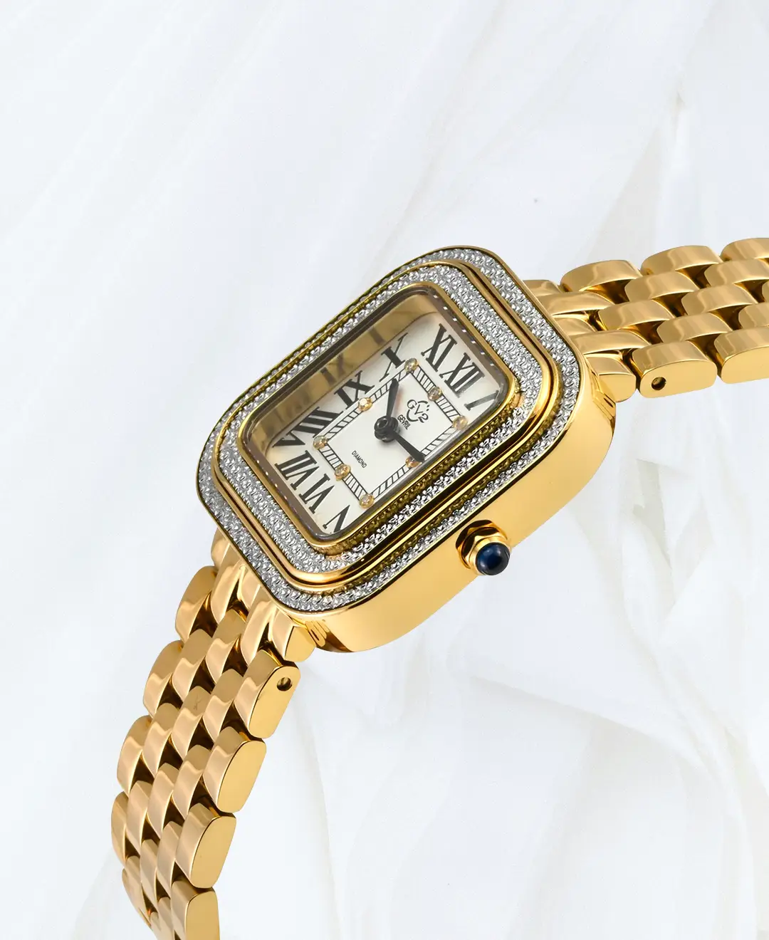 Side view of GV2 Bellagio women’s gold bracelet diamond watch with square case, diamond bezel and blue cabochon crown in Malta.
