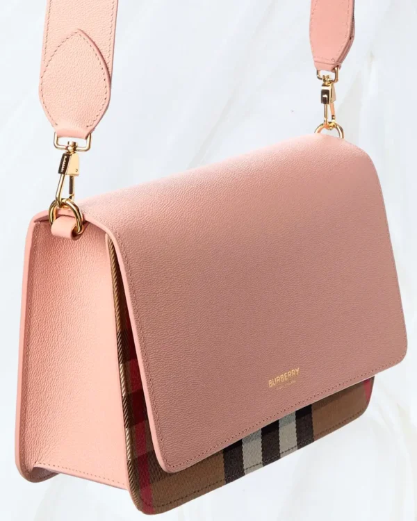 Angled view of Burberry Check Canvas & Leather Shoulder Bag in dusty pink