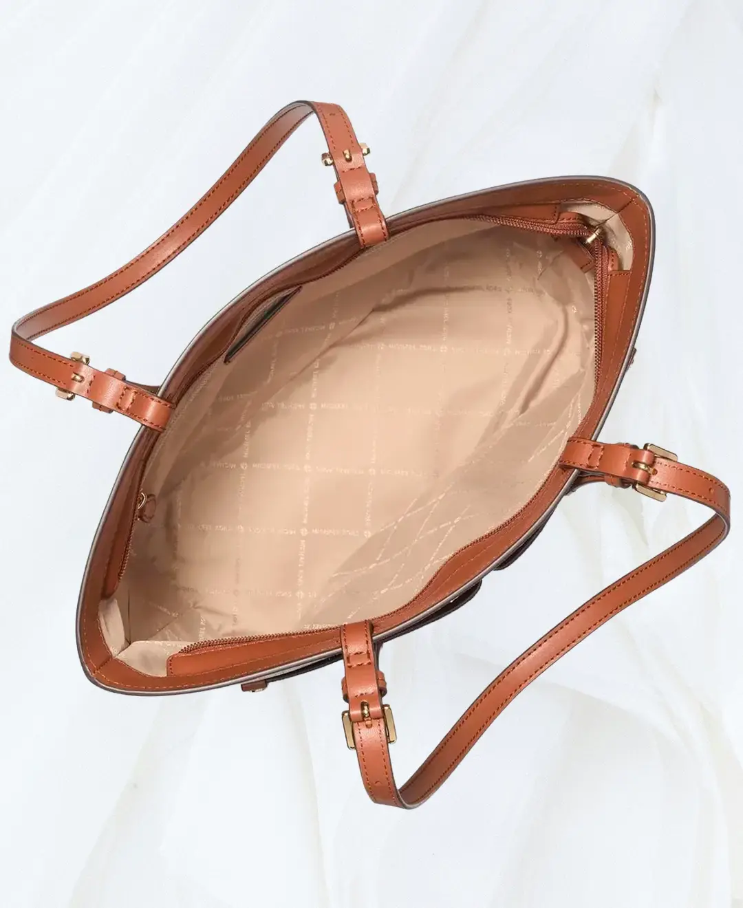 Michael Kors Jet Set Medium Logo Pocket Tote interior view in brown