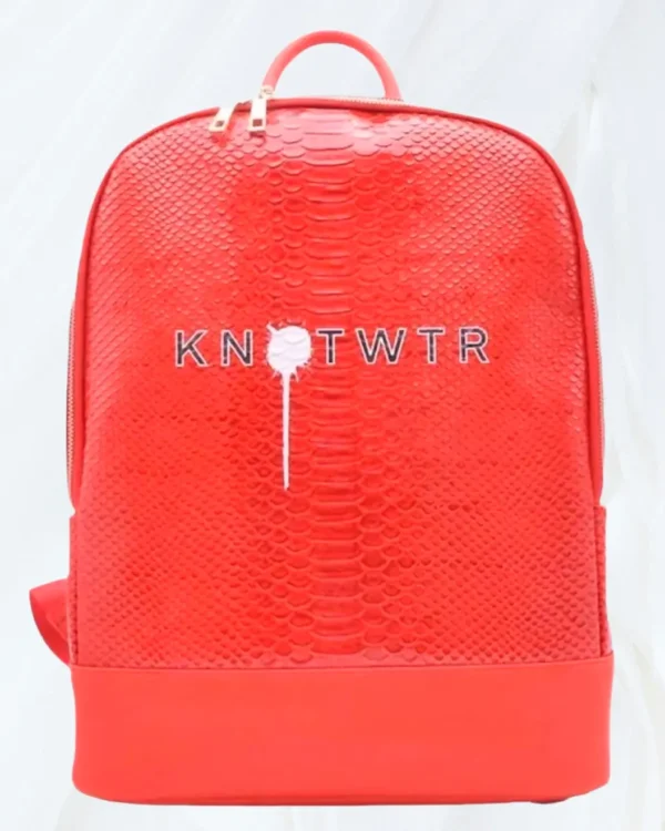 knotWTR women’s red leather travel backpack with textured front panel and top handle